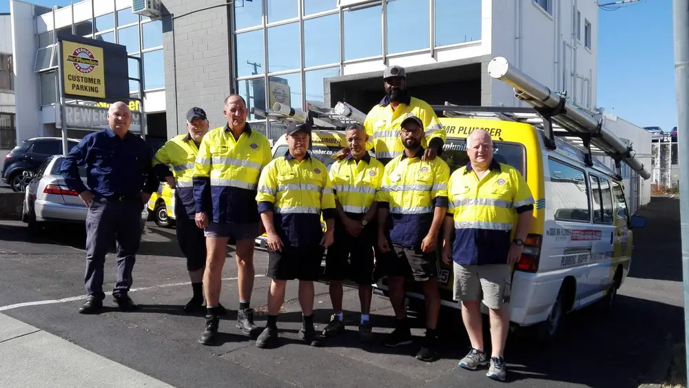 The Mr Plumber team with their van in Auckland
